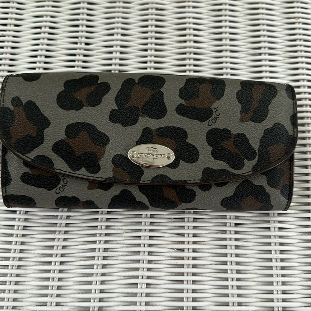 Coach multifunction wallet with extra pouch.